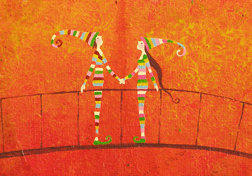 stripey people holding hands