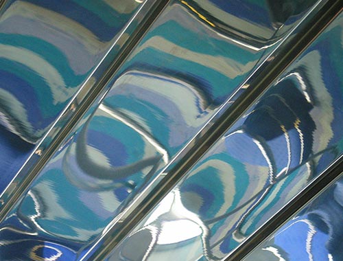 watery reflection on metal